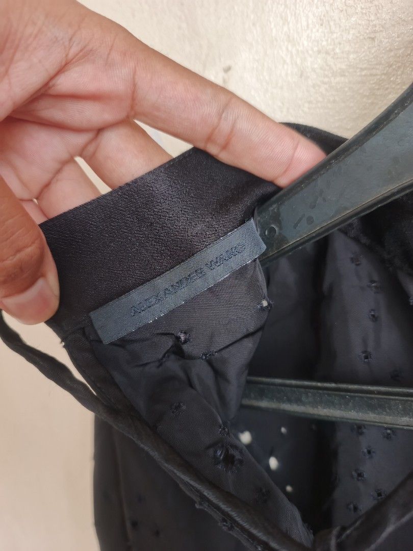 Alexander Wang Black Eyelet Button-Up Shirt (Category: Longsleeves) located in Dasmarinas. Submitted by jessicamae43174 (Listing ID 1462277825, Image 3). Description: - Brand: Alexander Wang - Color: Black - Features: All-over eyelet details - Closure: Button-up front - Unique Detail: Tie detail at the back neck - Material: 100% Viscose - Styling: Pairs well with jeans or trousers.