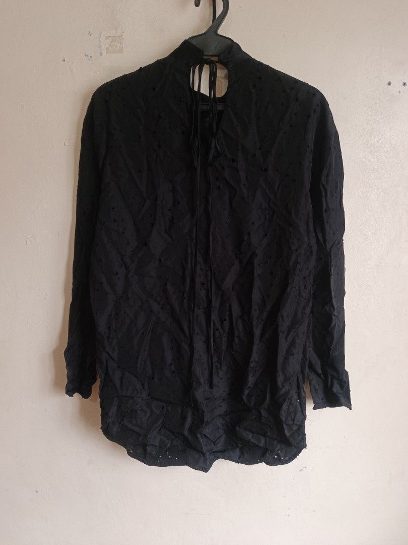 Alexander Wang Black Eyelet Button-Up Shirt (Category: Longsleeves) located in Dasmarinas. Submitted by jessicamae43174 (Listing ID 1462277825, Image 2). Description: - Brand: Alexander Wang - Color: Black - Features: All-over eyelet details - Closure: Button-up front - Unique Detail: Tie detail at the back neck - Material: 100% Viscose - Styling: Pairs well with jeans or trousers.