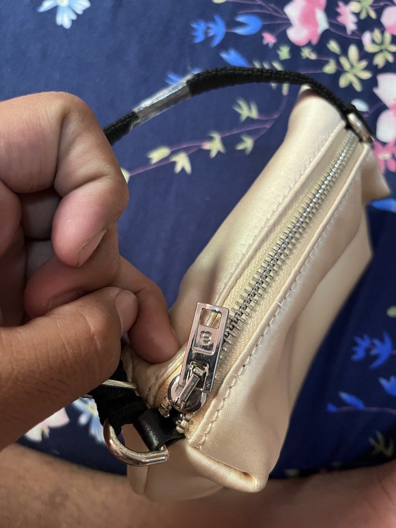 Alexander Wang Mini Bag with Rhinestone Logo (Category: Luxury Bags & Wallets) located in Quezon City. Submitted by reluxefinds2025 (Listing ID 1462286950, Image 3). Description: - Authentic Alexander Wang mini bag - Chic champagne satin-like material - 'WANG' logo strap embellished with rhinestones - Secure zipper closure - Compact size, ideal for essentials - Comes with a small inner leather pouch.