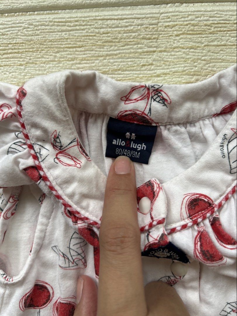 Allo & Lugh romper (Category: Babies & Kids Fashion) located in Cebu City. Submitted by yjainani (Listing ID 1462351785, Image 3). Description: cute white baby romper featuring an all-over red cherry print and delicate ruffled cap sleeves.