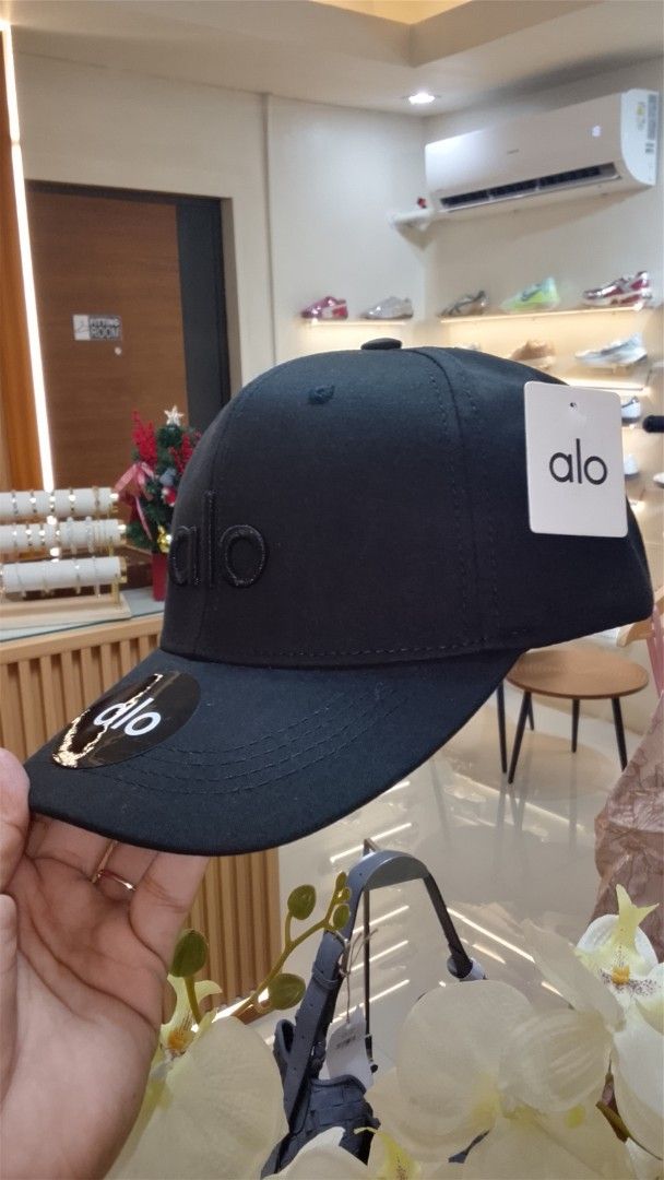 Alo Black Cap (Category: Caps & Hats) located in Bulacan. Submitted by imrolene (Listing ID 1462310210, Image 3). Description: - Classic black cap - Features embroidered Alo logo on the front - Includes Alo logo sticker on the brim - Simple and versatile design - Ideal for everyday use .