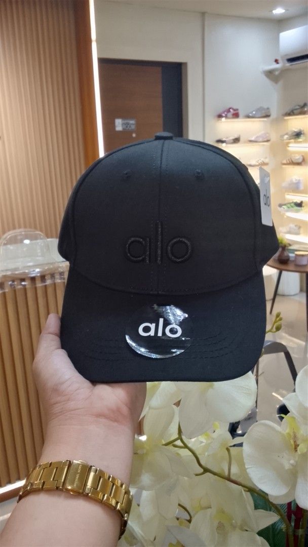 Alo Black Cap (Category: Caps & Hats) located in Bulacan. Submitted by imrolene (Listing ID 1462310210, Image 2). Description: - Classic black cap - Features embroidered Alo logo on the front - Includes Alo logo sticker on the brim - Simple and versatile design - Ideal for everyday use .