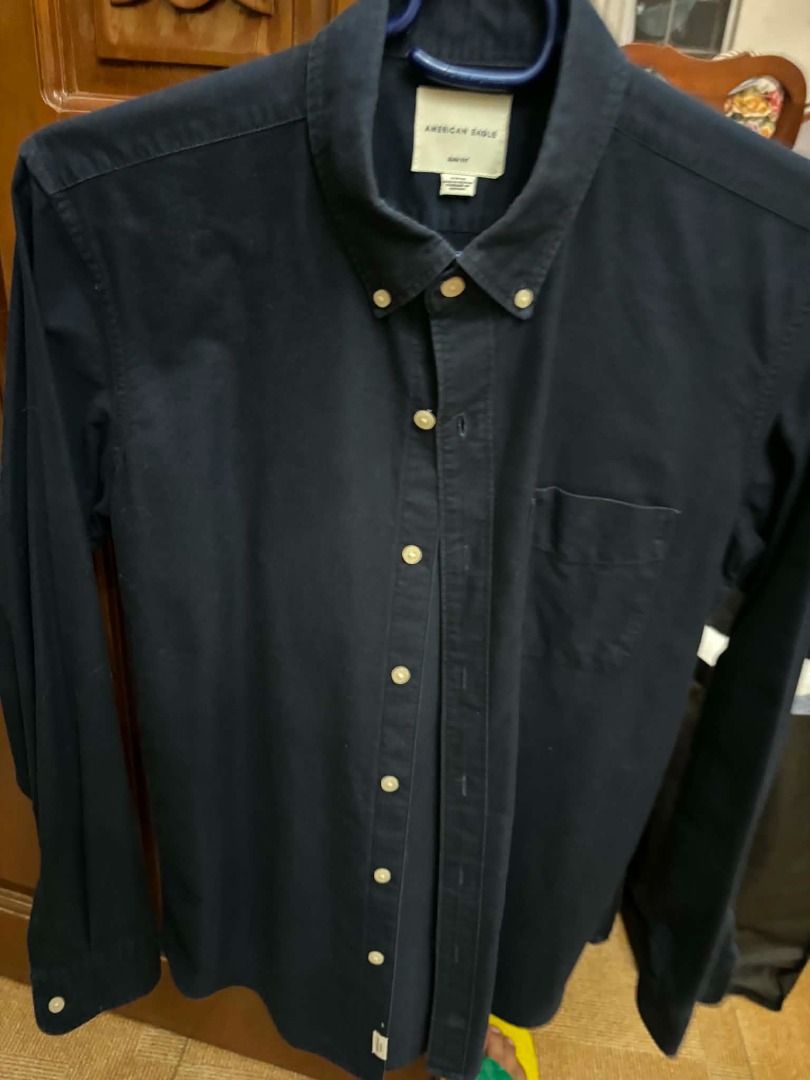 American Eagle Navy Blue Button Up Shirt (Category: Tshirts & Polo Shirts ) located in Caloocan City. Submitted by capurcosjo05601 (Listing ID 1462397263, Image 1). Description: - Classic navy blue button-up shirt - Brand: American Eagle.