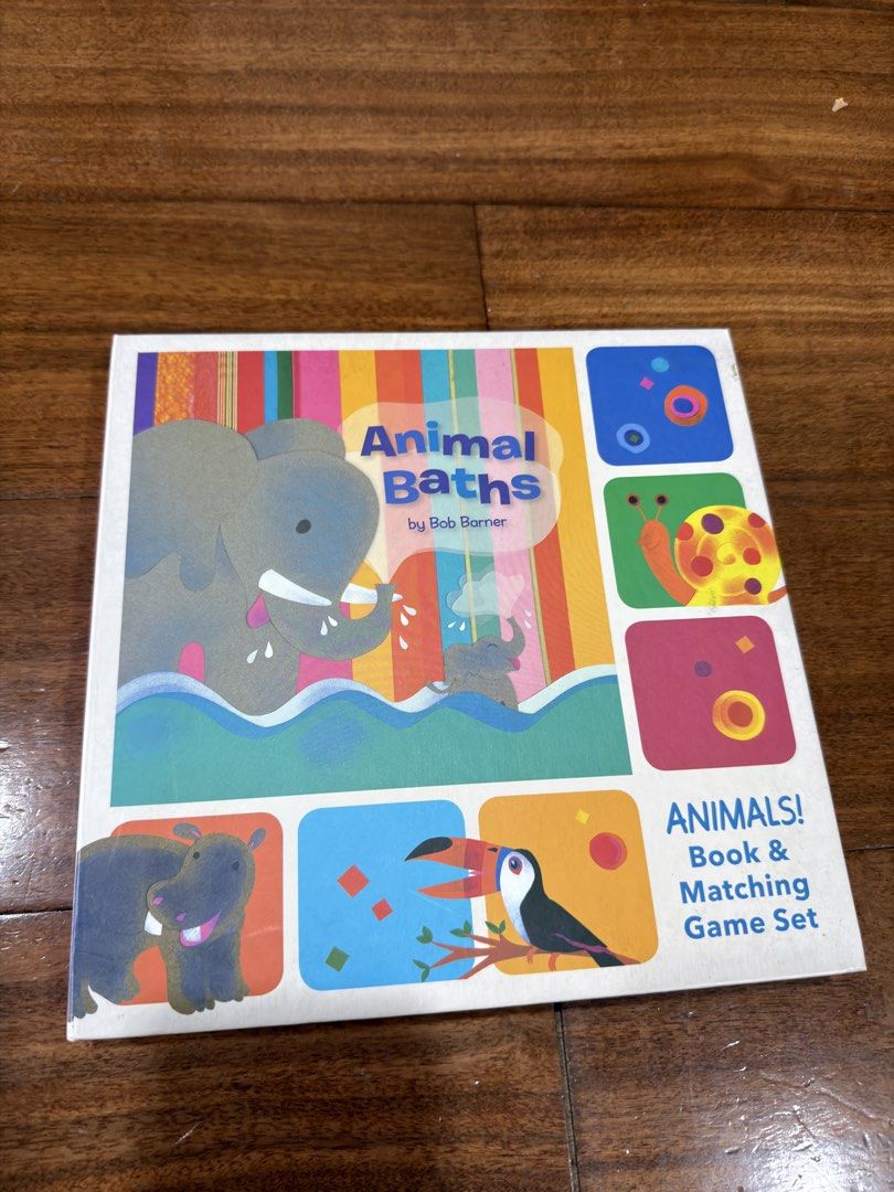 Animal Baths Book & Matching Game Set by Bob Barner (Category: Children's Books) located in San Juan City. Submitted by addieandmatty (Listing ID 1462284255, Image 1). Description: - Fun matching game perfect for little ones. - Includes a book about animals and bath time. - Features cute animal illustrations on cards (elephants, rhinos, toucans). - Great for learning and play. - Easy to learn with included instructions..