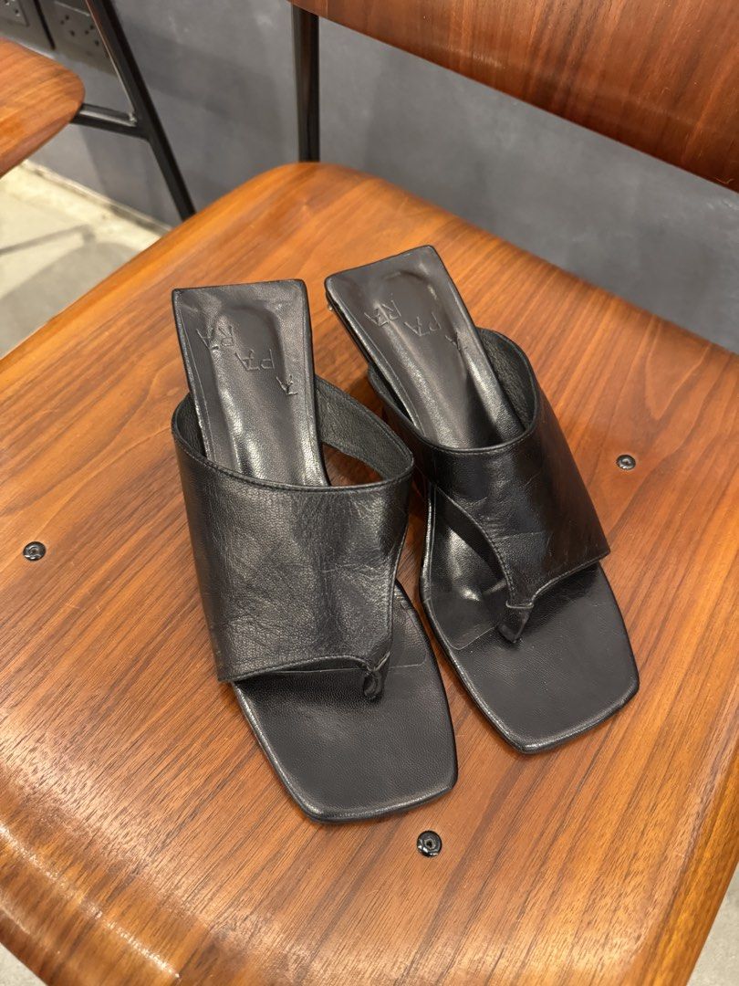 APARA Asymmetrical Wedge Heels in Black Leather (Category: Heels) located in Manila. Submitted by declutterkween14 (Listing ID 1462335613, Image 3). Description: - Brand: APARA - Color: Black - Material: Leather - Style: Asymmetrical wedge heels - Toe: Square toe - Detail: Thong strap - Heel: Comfortable wedge - Original Price: P6,200.00 - Sizing: Refer to size chart for measurements.