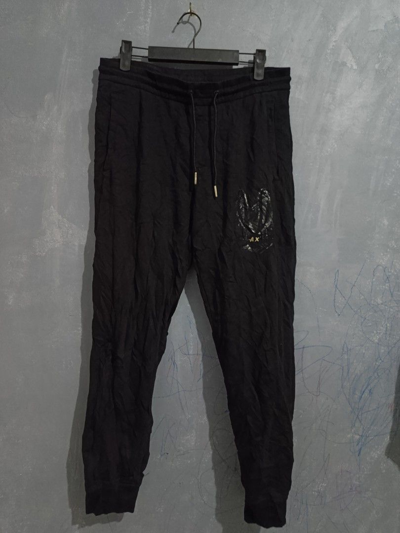 Armani Exchange Knitted Sweatpants Men's Black (Category: Joggers) located in Iloilo. Submitted by wendxcz-thrift- (Listing ID 1462367457, Image 3). Description: - Armani Exchange knitted sweatpants - Classic black color - Features iconic AX logo on the front - Adjustable drawstring waist for a custom fit - Ribbed cuffs for a snug feel - Designed for ultimate comfort and everyday wear - Please check photos for detailed condition MOP : GCASH/BPI +