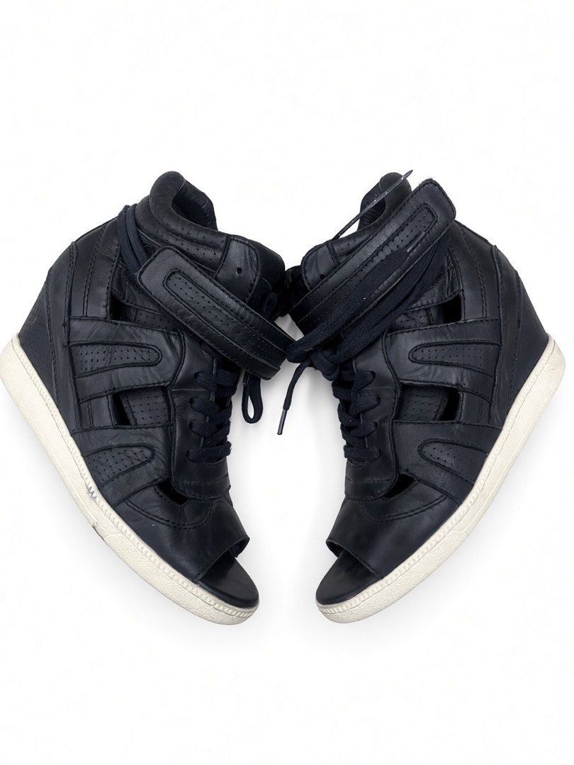 ASH OPEN-TOE HIDDEN WEDGE SNEAKERS (Category: Wedges) located in Lipa City. Submitted by alexcollectionco (Listing ID 1462379472, Image 1). Description: ASH black leather high-top open-toe sneakers featuring a hidden wedge heel, adjustable strap, cutout sides, and perforated accents. Built with genuine leather, durable rubber soles, and signature branding. Bold Y2K streetwear piece for punk, goth, alt, grunge, and archive fashion aesthetics. Size