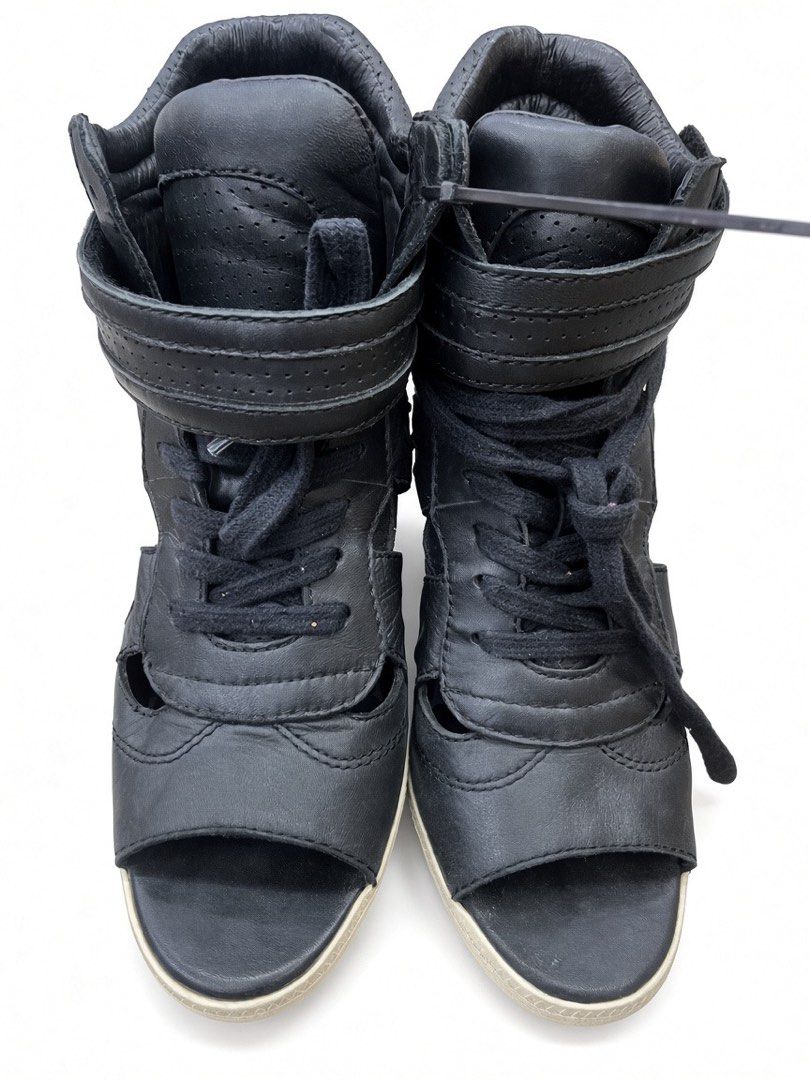 ASH OPEN-TOE HIDDEN WEDGE SNEAKERS (Category: Wedges) located in Lipa City. Submitted by alexcollectionco (Listing ID 1462379472, Image 2). Description: ASH black leather high-top open-toe sneakers featuring a hidden wedge heel, adjustable strap, cutout sides, and perforated accents. Built with genuine leather, durable rubber soles, and signature branding. Bold Y2K streetwear piece for punk, goth, alt, grunge, and archive fashion aesthetics. Size