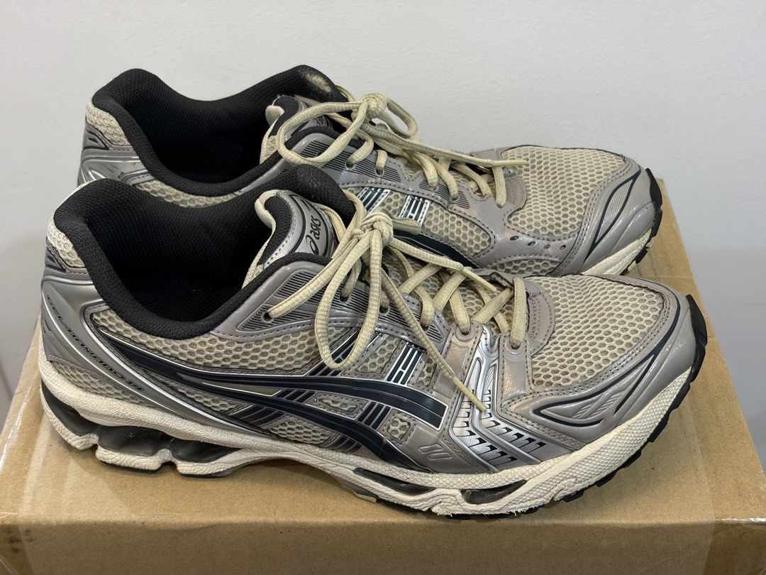 Asics Gel Kayano 14 (Category: Sneakers) located in Manila. Submitted by imaooo (Listing ID 1462353995, Image 2). Description: - ASICS Gel-Kayano 14 Running Shoes - Men's Size US 11 (EU 45, UK 10) - Color: Silver and Black - Ideal for running and everyday wear - Shows some signs of use on soles and uppers - Still has plenty of life left - Negotiable.