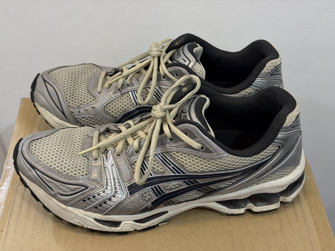 Asics Gel Kayano 14 (Category: Sneakers) located in Manila. Submitted by imaooo (Listing ID 1462353995, Image 1). Description: - ASICS Gel-Kayano 14 Running Shoes - Men's Size US 11 (EU 45, UK 10) - Color: Silver and Black - Ideal for running and everyday wear - Shows some signs of use on soles and uppers - Still has plenty of life left - Negotiable.