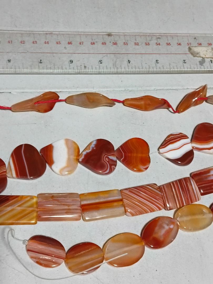 Assorted Agate Beads - Heart, Square, Oval, Twisted Petal/Leaf Shapes (Category: Necklaces) located in Marikina City. Submitted by my-an (Listing ID 1462380031, Image 1). Description: - Assorted agate beads - Shapes: Heart, Square, Oval, Twisted Petal/Leaf - Colors: Orange, Brown, White with natural banding - Ideal for jewelry making projects - Mix and match for unique designs - Available strung on red thread or clear string Brand new but old sto