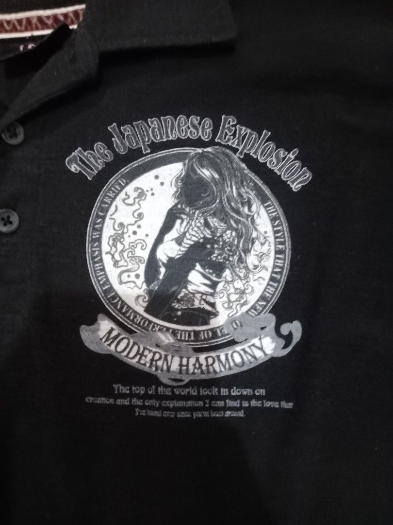 Atspauda Mariachi (Category: Tshirts & Polo Shirts ) located in Naga. Submitted by thrift.vincent (Listing ID 1462318815, Image 2). Description: Black short sleeve polo shirt from Lock Heaven. Three-button placket, ribbed collar. Graphic on left chest shows a woman in a circle with text reading The Japanese Explosion and Modern Harmony. Graphic on right sleeve reads Profundity explanation The top of the world The fusion Japan. Brand tag at neck r