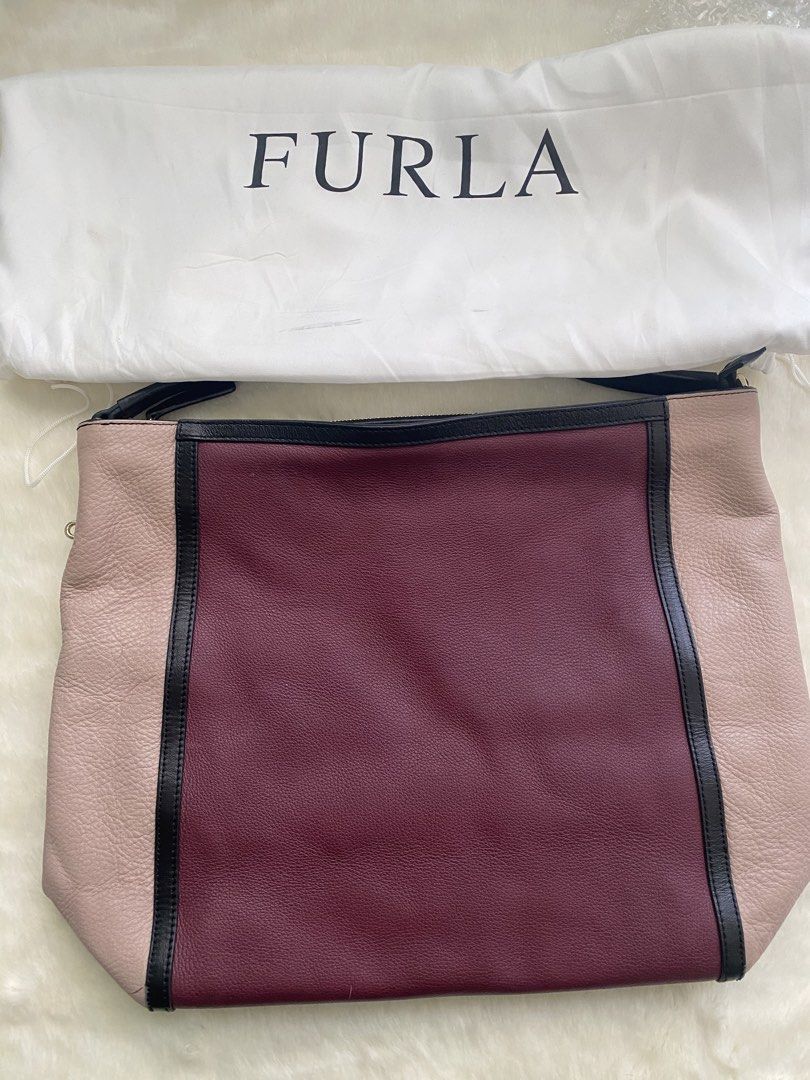 [AUTHENTIC] Furla Colorblock Leather Shoulder Bag (Category: Luxury Bags & Wallets) located in Santa Rosa. Submitted by rjaarmblo (Listing ID 1462408357, Image 2). Description: - Authentic Furla shoulder bag - Stylish colorblock design: burgundy, beige, and black panels - Genuine leather material - Secure zipper closure - Comes with original Furla dust bag - Please note: Small crack on leather trim on one side (refer to the last photo for details