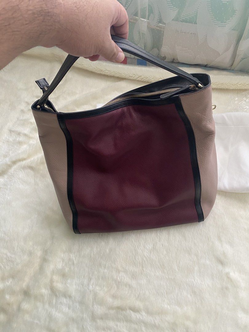 [AUTHENTIC] Furla Colorblock Leather Shoulder Bag (Category: Luxury Bags & Wallets) located in Santa Rosa. Submitted by rjaarmblo (Listing ID 1462408357, Image 3). Description: - Authentic Furla shoulder bag - Stylish colorblock design: burgundy, beige, and black panels - Genuine leather material - Secure zipper closure - Comes with original Furla dust bag - Please note: Small crack on leather trim on one side (refer to the last photo for details