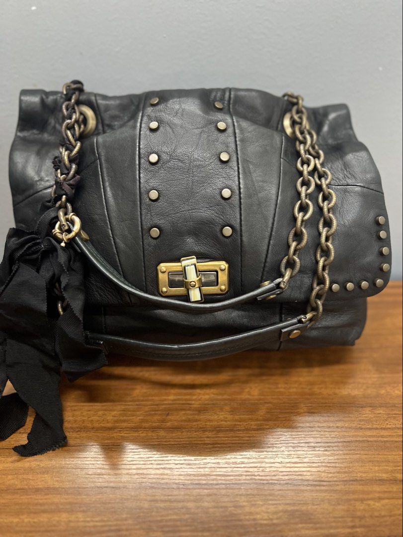 Authentic Lanvin Happy Shoulder Bag (Category: Luxury Bags & Wallets) located in Cagayan de Oro. Submitted by riggstuffs (Listing ID 1462407398, Image 1). Description: ➡️ Guaranteed Authentic Lanvin Happy shoulder bag ➡️ Made in Italy ➡️ Exterior is made of soft leather material, no rubs or scuffs, minimal signs of use of the grosgrain ribbon and lost charms ➡️ Interior area is very clean and no foul smell. ➡️ Dimension: 17cm x17cm x 3cm ➡️ No ot