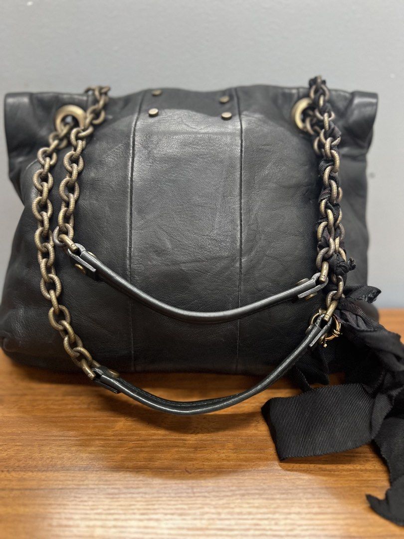 Authentic Lanvin Happy Shoulder Bag (Category: Luxury Bags & Wallets) located in Cagayan de Oro. Submitted by riggstuffs (Listing ID 1462407398, Image 2). Description: ➡️ Guaranteed Authentic Lanvin Happy shoulder bag ➡️ Made in Italy ➡️ Exterior is made of soft leather material, no rubs or scuffs, minimal signs of use of the grosgrain ribbon and lost charms ➡️ Interior area is very clean and no foul smell. ➡️ Dimension: 17cm x17cm x 3cm ➡️ No ot
