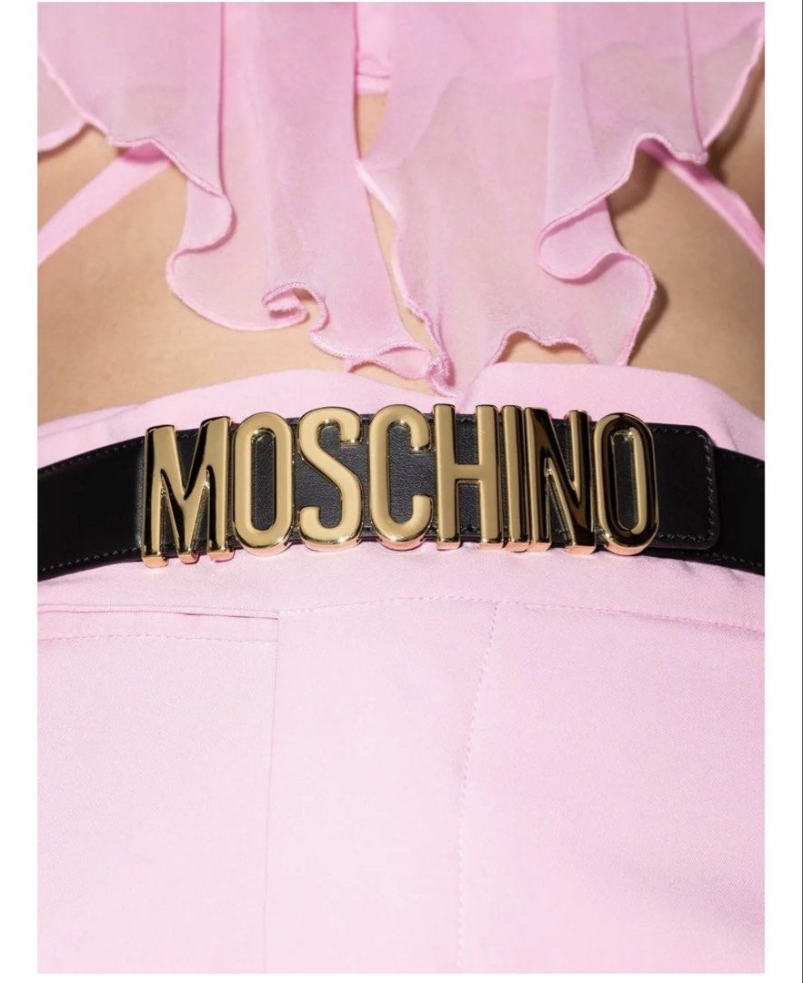 Authentic Moschino Logo-Plaque Leather Belt (Category: Belts) located in Manila. Submitted by luxestuffph (Listing ID 1462312563, Image 2). Description: - Classic black leather belt from Moschino - Features the iconic gold logo buckle - Adds a statement to any outfit - Adjustable with multiple holes - Size 42.