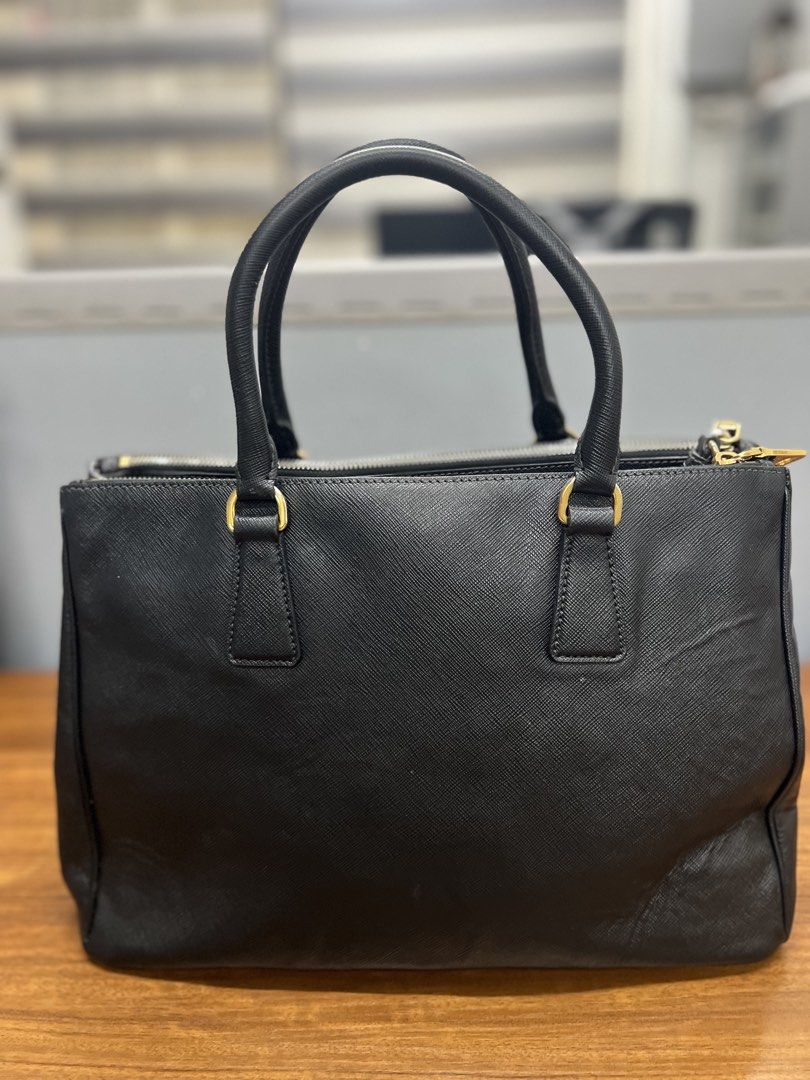 Authentic Prada Saffiano Lux leather Bag (Category: Luxury Bags & Wallets) located in Cagayan de Oro. Submitted by riggstuffs (Listing ID 1462408851, Image 2). Description: ➡️ Guaranteed Authentic Prada Saffiano Lux Leather bag ➡️ Made in Italy ➡️ With code ➡️ Exterior area is in very good condition, no scuffs or runs at the corner, the only sign of use is the lower back area. ➡️ Interior is clean, no fouls odor. ➡️ With certificate from Legit Gr
