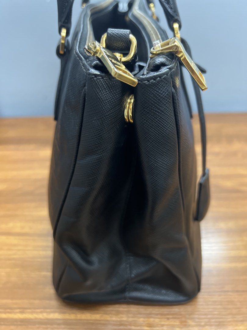 Authentic Prada Saffiano Lux leather Bag (Category: Luxury Bags & Wallets) located in Cagayan de Oro. Submitted by riggstuffs (Listing ID 1462408851, Image 3). Description: ➡️ Guaranteed Authentic Prada Saffiano Lux Leather bag ➡️ Made in Italy ➡️ With code ➡️ Exterior area is in very good condition, no scuffs or runs at the corner, the only sign of use is the lower back area. ➡️ Interior is clean, no fouls odor. ➡️ With certificate from Legit Gr