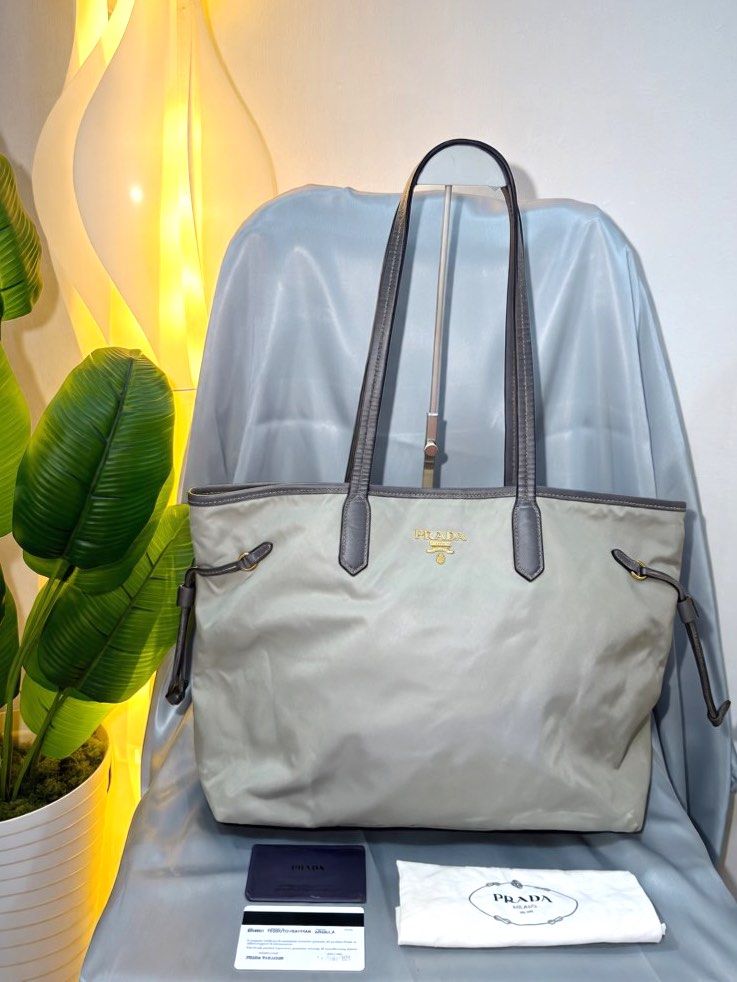 Authentic PRADA tessuto nylon neverfull style tote shoulder bag (Category: Luxury Bags & Wallets) located in Paranaque City. Submitted by houseofcarry (Listing ID 1462365056, Image 2). Description: -Guaranteed Authentic 💯 -Comes with COA card and envelope. -In very good pre-loved condition, with no major flaws. Shows only minimal signs of use, including minor color oxidation on select areas due to age and usage, which is subtle and not noticeabl