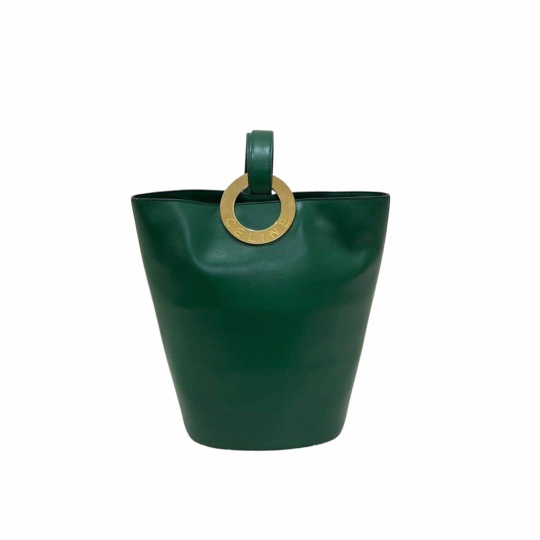 Authentic Vintage Celine Circle Logo Bucket Bag (Category: Luxury Bags & Wallets) located in Manila. Submitted by ladybagmnl (Listing ID 1462324494, Image 1). Description: Rare vintage Celine bucket bag in deep green with gold hardware. Classic minimalist piece with a really nice structure.Features two interior pockets (one zipped, one slip pocket). DM for more photos Material: Leather Size: 11"Wx 10.8"H (approx.) Condition: Excellent vintage con