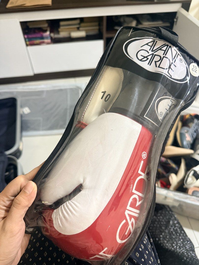 Avant Garde 10oz Boxing Gloves with Bag (Category: Combat Sports) located in Caloocan City. Submitted by geemariell56161 (Listing ID 1462414072, Image 1). Description: - Avant Garde boxing gloves - Size: 10oz - Color: Red and white - Perfect for training or sparring - Comes with a clear zippered bag for protection and easy carrying.