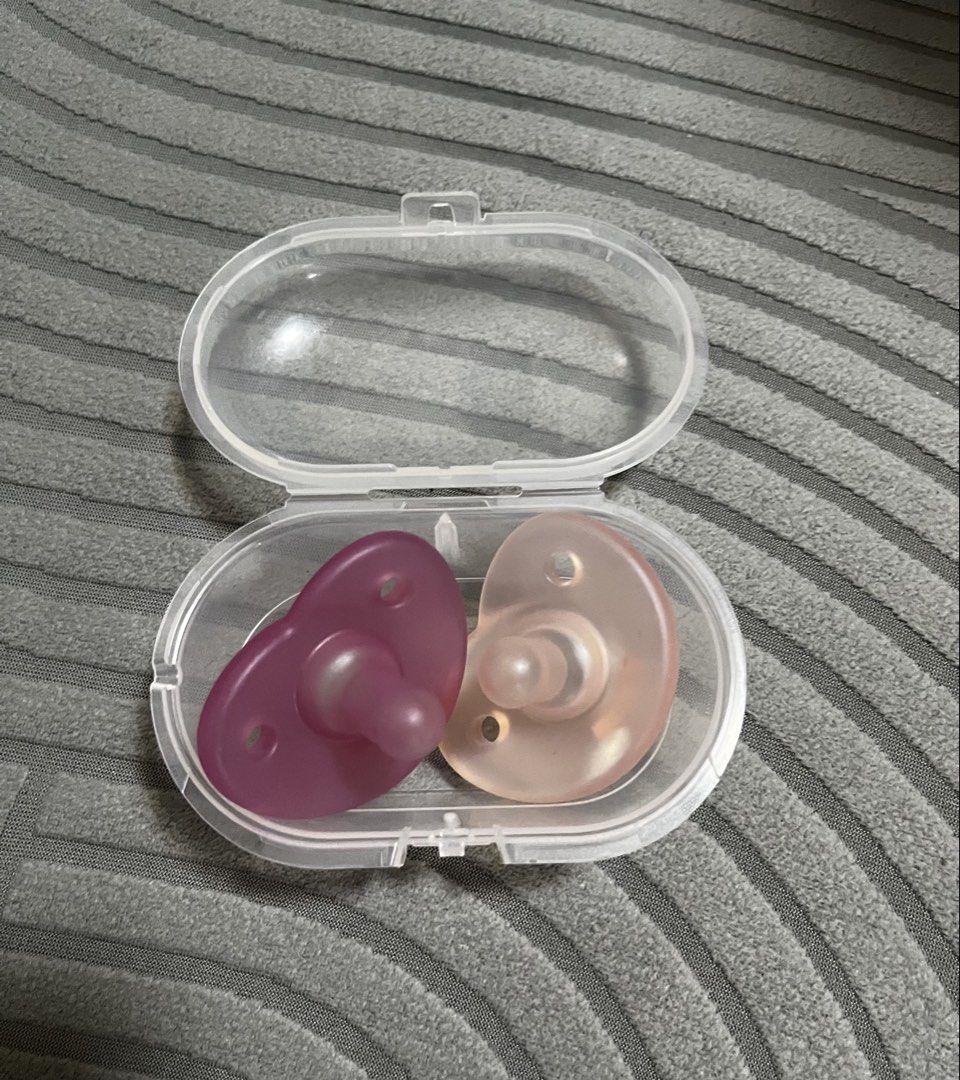 Avent Pacifiers with Case (Category: Soothers & Pacifiers) located in General Santos City (Dadiangas). Submitted by my_lzlove (Listing ID 1462397145, Image 1). Description: Pink- unused Purple- barely used For 0-6mos.