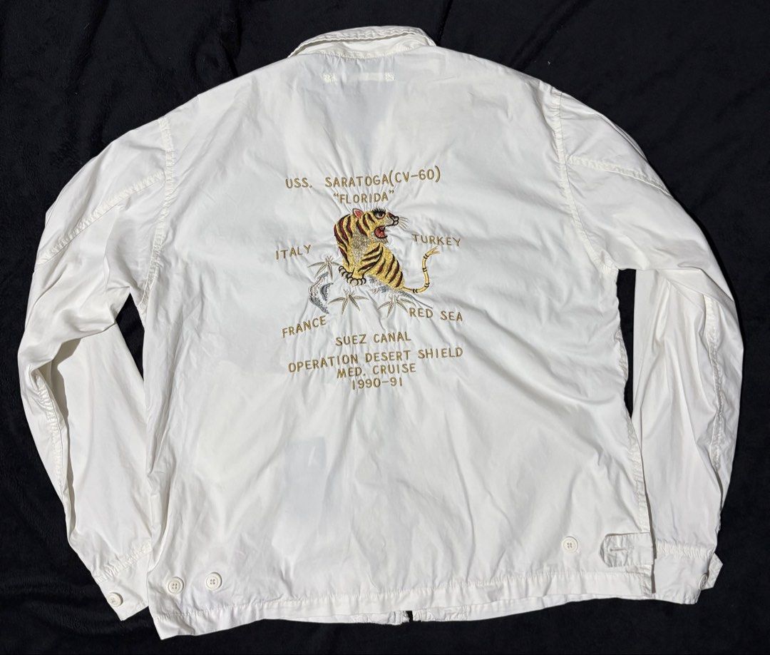 Avirex White Jacket USS Saratoga Operation Desert Shield (Category: Coats, Jackets and Outerwear) located in Pasay City. Submitted by wornfitsco (Listing ID 1462284901, Image 3). Description: 🛩 Vintage Avirex Souvenir Jacket (90-91) Rare vintage Avirex souvenir jacket with premium embroidery and military-inspired styling. Collector-worthy piece. 📏 24.5 x 27.5 ✨ Condition: New 💰 ₱1300 ⚡ No issues.
