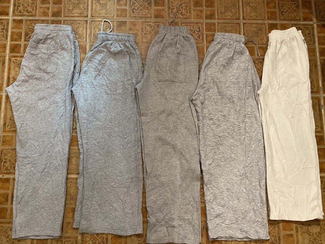 Baggy Sweatpants - (380 each) (Category: Other Bottoms) located in Manila. Submitted by thriftvibes324 (Listing ID 1462397971, Image 2). Description: - Bundle of 5 sweatpants - Colors: 4 Grey, 1 White - Features elastic waistband with drawstring - Some sweatpants include pockets - Comfortable material, perfect for lounging or casual wear.