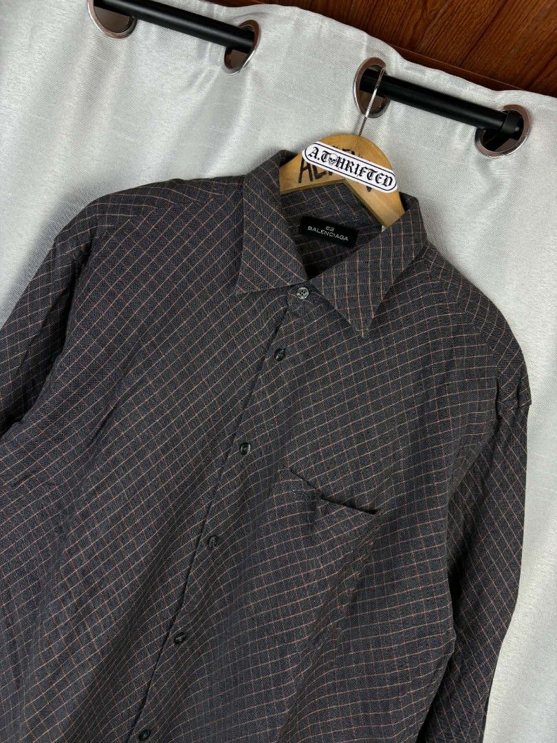Balenciaga Button-Up Shirt - Grey Plaid Pattern (Category: Tshirts & Polo Shirts ) located in Tanza. Submitted by aldrintamayo (Listing ID 1462305232, Image 2). Description: - Balenciaga button-up shirt - Color: Grey with orange plaid pattern - Style: Classic collar, button-down front - Features: Single chest pocket - Size: Tag shows 6 (185/96A) - Ideal for: Smart casual outfits.