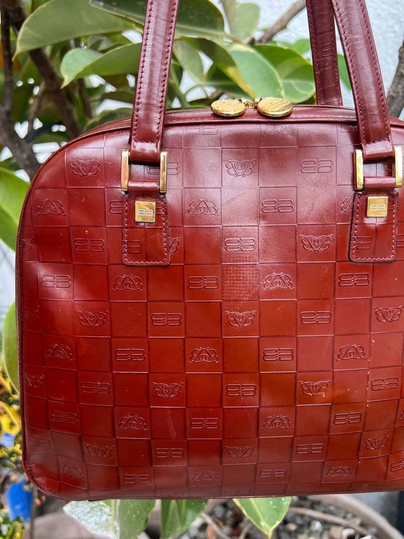 Balenciaga Paris Monogram Shoulder Bag (Category: Luxury Bags & Wallets) located in Bacolod City. Submitted by novymaesel14868 (Listing ID 1462339135, Image 2). Description: - Vintage Balenciaga shoulder bag - Rich burgundy color with embossed monogram pattern - Gold hardware details - Interior zippered pocket - Balenciaga logo on zipper pull - Classic piece, great for daily use.