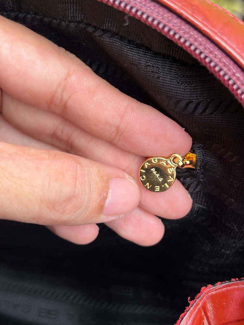 Balenciaga Paris Monogram Shoulder Bag (Category: Luxury Bags & Wallets) located in Bacolod City. Submitted by novymaesel14868 (Listing ID 1462339135, Image 3). Description: - Vintage Balenciaga shoulder bag - Rich burgundy color with embossed monogram pattern - Gold hardware details - Interior zippered pocket - Balenciaga logo on zipper pull - Classic piece, great for daily use.