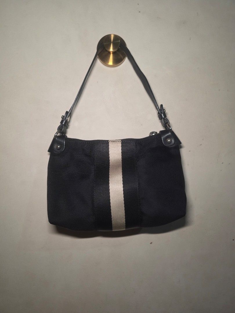 BALLY Canvas with Leather Strap Pochette Shoulder Bag (Authentic) (Category: Luxury Bags & Wallets) located in Manila. Submitted by dcory (Listing ID 1462345978, Image 3). Description: Brand: Bally Material: Canvas Color: Black Width: 9 inches Height: 5.5 inches Interior Pockets: One zipped pocket, Two flat pockets - With serial code - Please expect signs of wear and a few scratches since this is a preloved item.