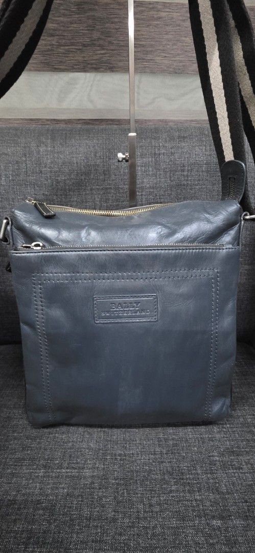 Bally Leather Crossbody Bag (Category: Cross-body Bags) located in General Trias. Submitted by roselle2230 (Listing ID 1462416132, Image 1). Description: - Genuine Bally grey leather crossbody bag - Secure zip closure - Multiple interior compartments for organization - Signature Bally stripe lining - Adjustable strap for comfortable wear - Perfect for everyday use.