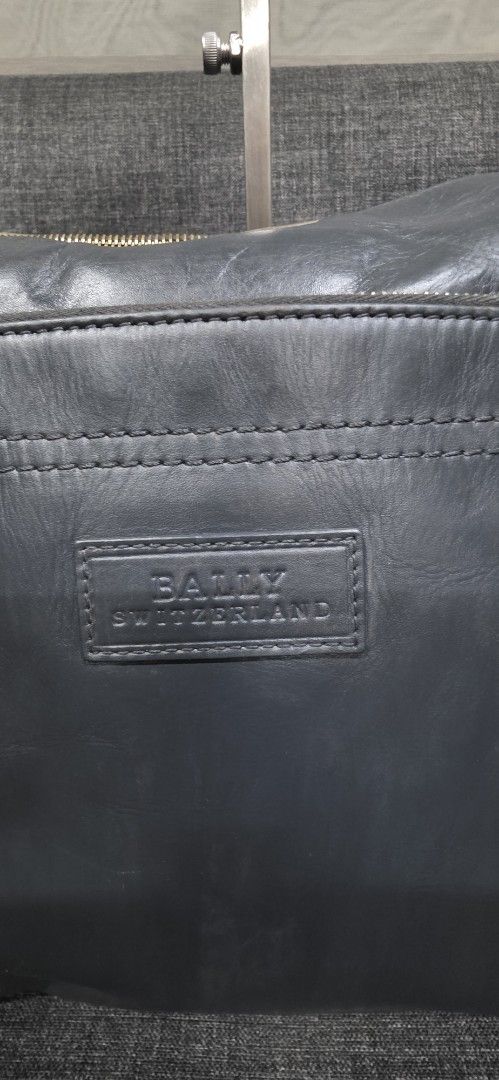 Bally Leather Crossbody Bag (Category: Cross-body Bags) located in General Trias. Submitted by roselle2230 (Listing ID 1462416132, Image 3). Description: - Genuine Bally grey leather crossbody bag - Secure zip closure - Multiple interior compartments for organization - Signature Bally stripe lining - Adjustable strap for comfortable wear - Perfect for everyday use.