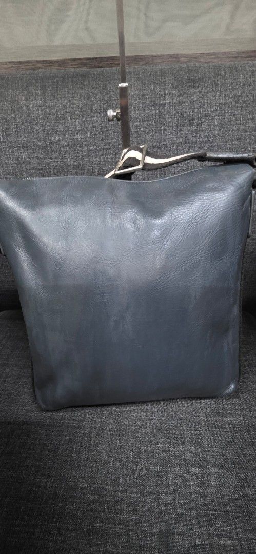 Bally Leather Crossbody Bag (Category: Cross-body Bags) located in General Trias. Submitted by roselle2230 (Listing ID 1462416132, Image 2). Description: - Genuine Bally grey leather crossbody bag - Secure zip closure - Multiple interior compartments for organization - Signature Bally stripe lining - Adjustable strap for comfortable wear - Perfect for everyday use.