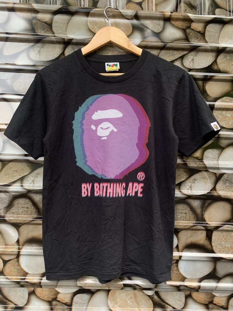 BAPE By Bathing Ape Graphic Tee T-Shirt (Category: Tshirts & Polo Shirts ) located in Aloran. Submitted by chester78864 (Listing ID 1462356765, Image 1). Description: - Black BAPE T-shirt - Features a cool glitch-style ape graphic - Text reads 'BY BATHING APE' - Made from 100% cotton - Tagged size S - Ideal for streetwear enthusiasts.