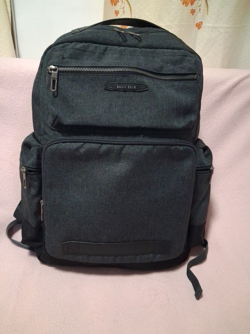 BASIC ELLE Dark Grey Backpack (Category: Backpacks) located in Angeles City. Submitted by anneps (Listing ID 1462407741, Image 1). Description: - Dark grey BASIC ELLE backpack - Multiple compartments and pockets for organization - Padded straps for comfortable carrying - Sturdy zippers with a good feel - Spacious interior, perfect for daily use or travel.