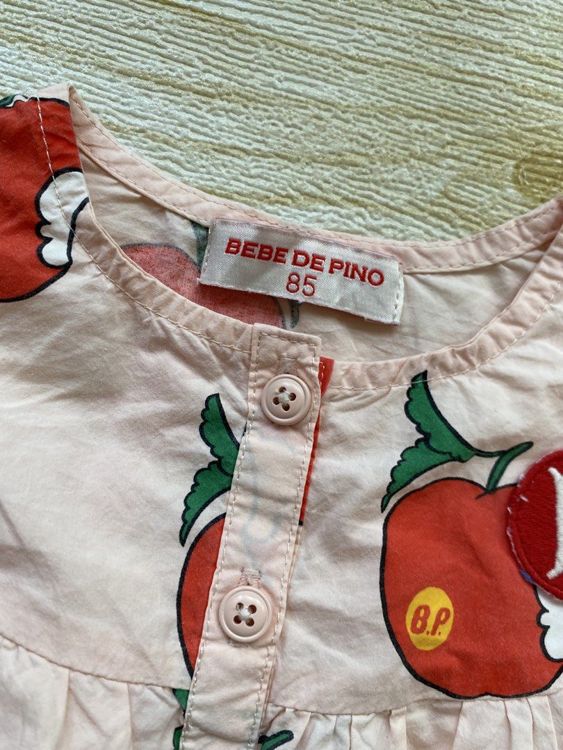 Bebe de Pino Puff Sleeve Blouse (Category: Babies & Kids Fashion) located in Cebu City. Submitted by yjainani (Listing ID 1462375378, Image 3). Description: peach-colored children's All Over Pomme Puff Sleeve Blouse from Bebe De Pino featuring an all-over apple print and a "B" letter patch detail best fit 12m.