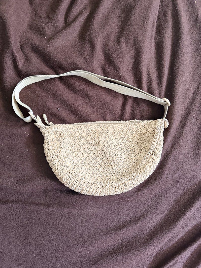 Beige Crochet Half Moon Sling Bag (Category: Cross-body Bags) located in Quezon City. Submitted by msmarjqab (Listing ID 1462332631, Image 1). Description: - Cute beige crochet bag - Half-moon shape - Zipper closure - Adjustable strap - Smooth fabric lining - Ideal for casual outings and beach trips - Easy to style with any outfit.