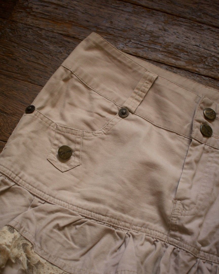 Beige Layered Skirt with Ruffles (Category: Skirts) located in Quezon City. Submitted by yakutayo (Listing ID 1462283277, Image 2). Description: Beige Layered Skirt with Ruffles brand: none — waistline: 27.5 — length: 15 condition: 10/10 Details: ★ complete and working buttons ★ functional pockets on both the front and back ★ lace trims details ★ has belt hoops Flaws: None!.