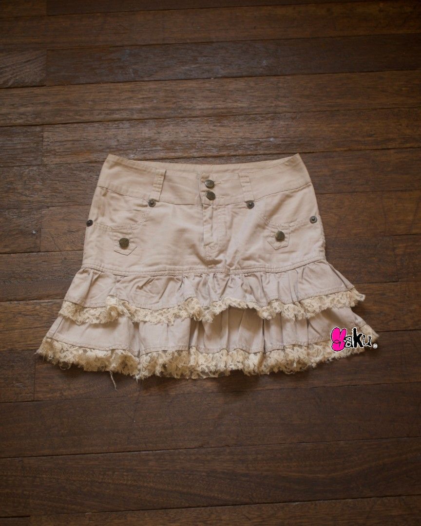 Beige Layered Skirt with Ruffles (Category: Skirts) located in Quezon City. Submitted by yakutayo (Listing ID 1462283277, Image 1). Description: Beige Layered Skirt with Ruffles brand: none — waistline: 27.5 — length: 15 condition: 10/10 Details: ★ complete and working buttons ★ functional pockets on both the front and back ★ lace trims details ★ has belt hoops Flaws: None!.