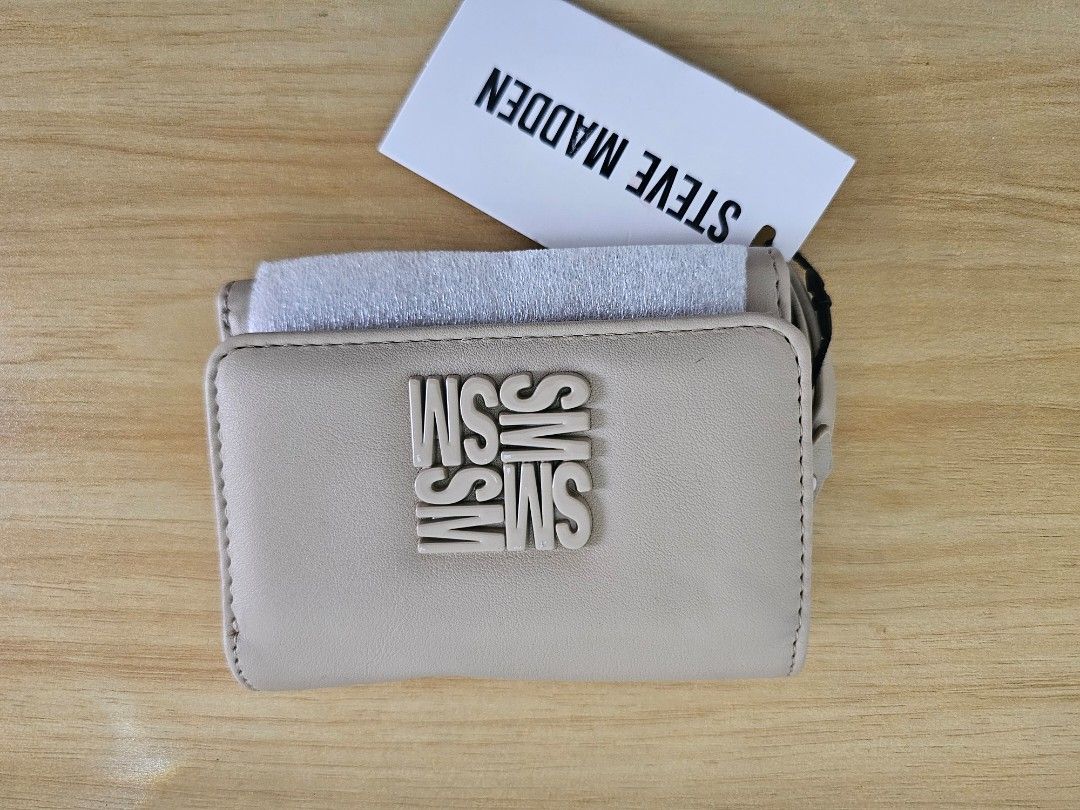 Beige Tri-Fold Wallet with Zipper Coin Pocket (Category: Wallets & Card holders) located in Manila. Submitted by tokyo_thv (Listing ID 1462285178, Image 1). Description: - Adorable beige tri-fold wallet - Features multiple card slots - Includes a convenient zipper pocket for coins - Comes with original tag attached - Ideal for everyday essentials.