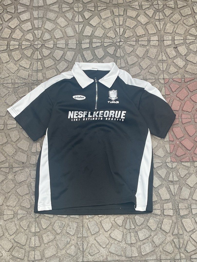 Black & White Zip Polo Shirt with Graphics (Category: Tshirts & Polo Shirts ) located in Mabalacat. Submitted by epicforest_78284 (Listing ID 1462398369, Image 1). Description: - Stylish black and white polo shirt - Features a convenient zip at the neck - Eye-catching graphics on the front - Sporty and casual style - Ideal for everyday wear.