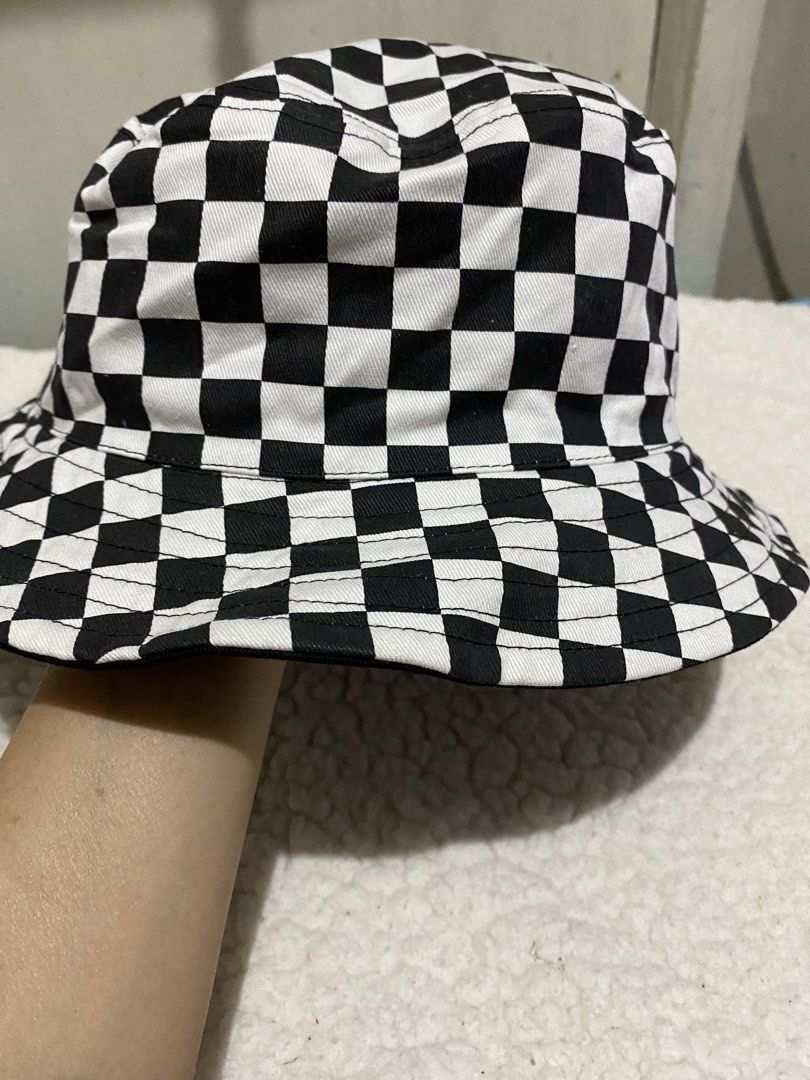Black and White Checkerboard Bucket Hat (Category: Hats & Beanies) located in Manila. Submitted by resi.diaz (Listing ID 1462423215, Image 3). Description: - Trendy checkerboard bucket hat in black and white. - Features a plain black interior. - Ideal for sunny weather or as a stylish accessory. - Effortless to wear and style..