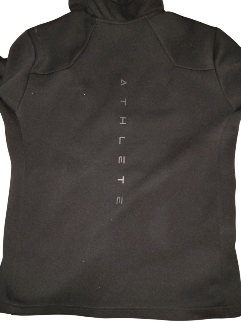 Black ATHLETE Zip-Up Hoodie Jacket (Category: Coats, Jackets and Outerwear) located in Quezon City. Submitted by y2k_thriftkid (Listing ID 1462278314, Image 2). Description: - Black zip-up hoodie jacket - Features a hood and full zip closure - 'ATHLETE' text printed vertically on the back - Ideal for casual wear or workouts.