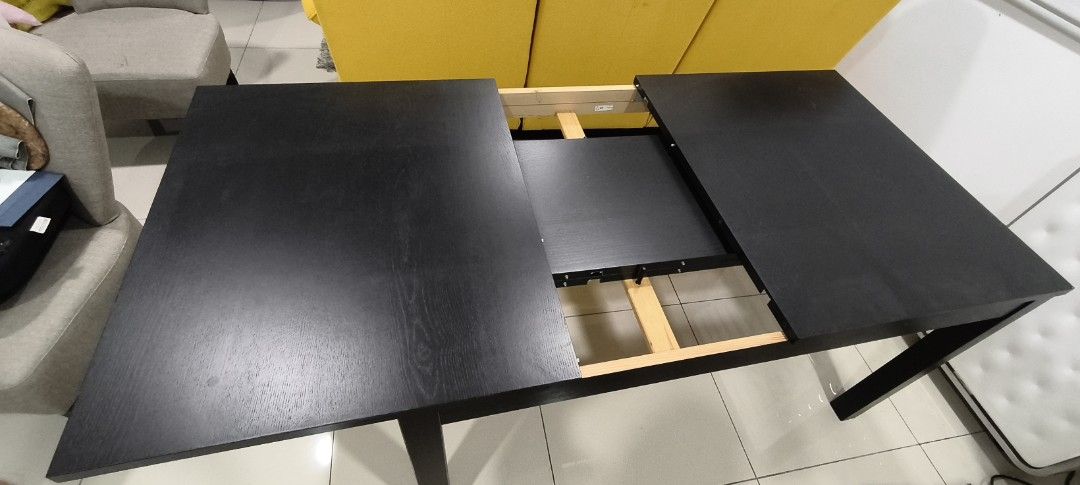 Black Extendable Dining Table (Category: Tables & Sets) located in Kuala Lumpur. Submitted by gentlewhale_f5b0fd (Listing ID 1462354763, Image 3). Description: IKEA BJURSTA Extendable Dining Table (Meja Makan) – Good Condition Meja makan IKEA BJURSTA (boleh dipanjangkan/extendable) untuk dijual sebab nak clear space. Condition mantap, mechanism sliding berjalan lancar. Ada tempat simpan panel extra kat bawah meja so jimat ruang. • Harga: RM 480 (