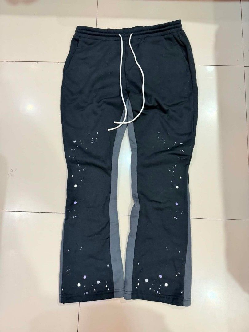 Black Flare Pants with Paint Splatter Detail (Category: Other Bottoms) located in Manila. Submitted by thrift.glaizee (Listing ID 1462429176, Image 1). Description: - Black flare pants - Grey side panels - White and purple paint splatter design - Comfortable drawstring waist - Ideal for casual wear.