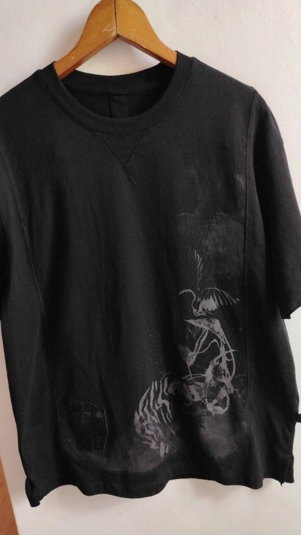 Black Graphic T-Shirt (Category: Tshirts & Polo Shirts ) located in Cavite. Submitted by ukaynglahat (Listing ID 1462278501, Image 3). Description: - Black t-shirt - Features a cool tiger and bird graphic print on the front - Small emblem on the lower left front - Plain black back with a center seam - Short sleeves - Crew neck - Comfortable fit.