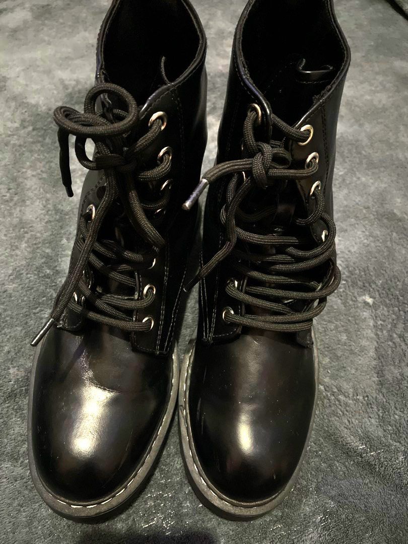 Black Lace-Up Chunky Platform Boots (Category: Boots) located in Manila. Submitted by myshanshine (Listing ID 1460853249, Image 1). Description: - Black faux leather ankle boots - Lace-up front for a secure fit - Chunky platform sole for added height and style - Excellent grip on the sole - Versatile: pairs well with jeans and dresses - Ideal for everyday wear.